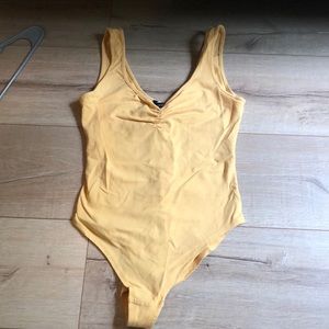 Yellow body suit